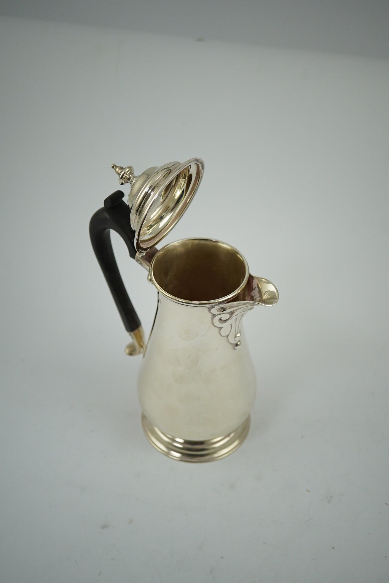 A George VI silver hot water pot, by George Howson